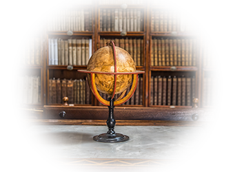 Antique globe surrounded by historical books